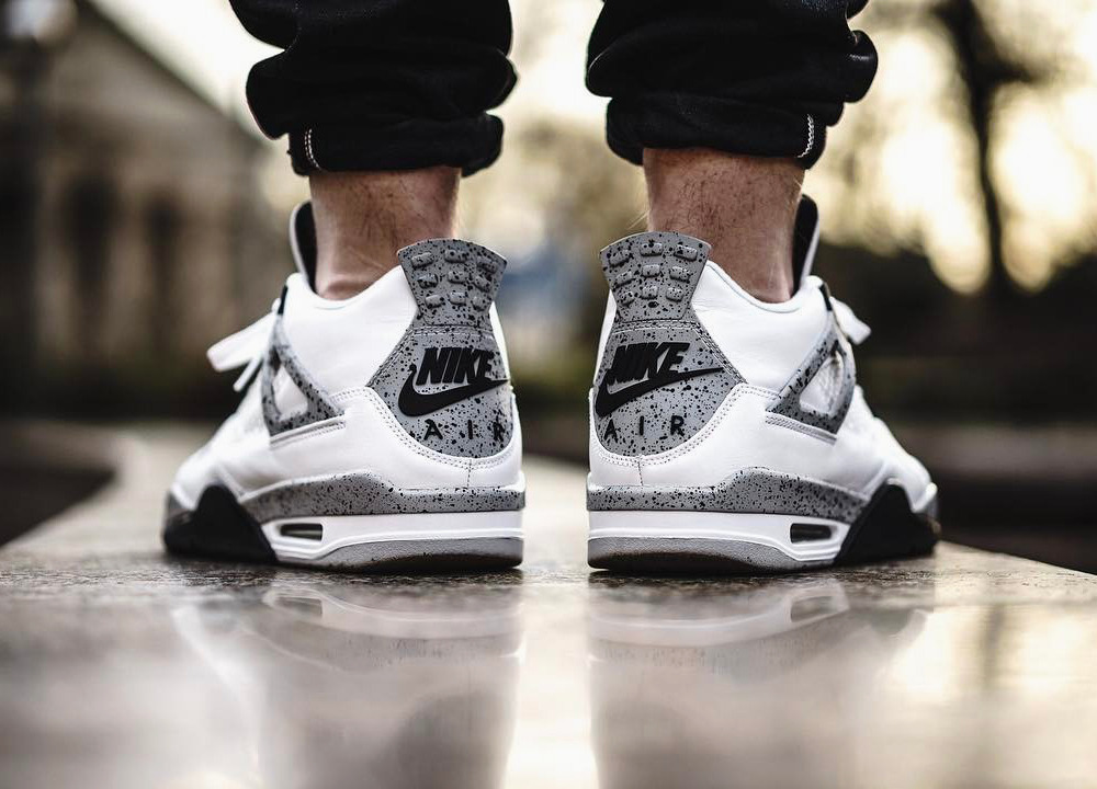 jordan 4 white cement on feet