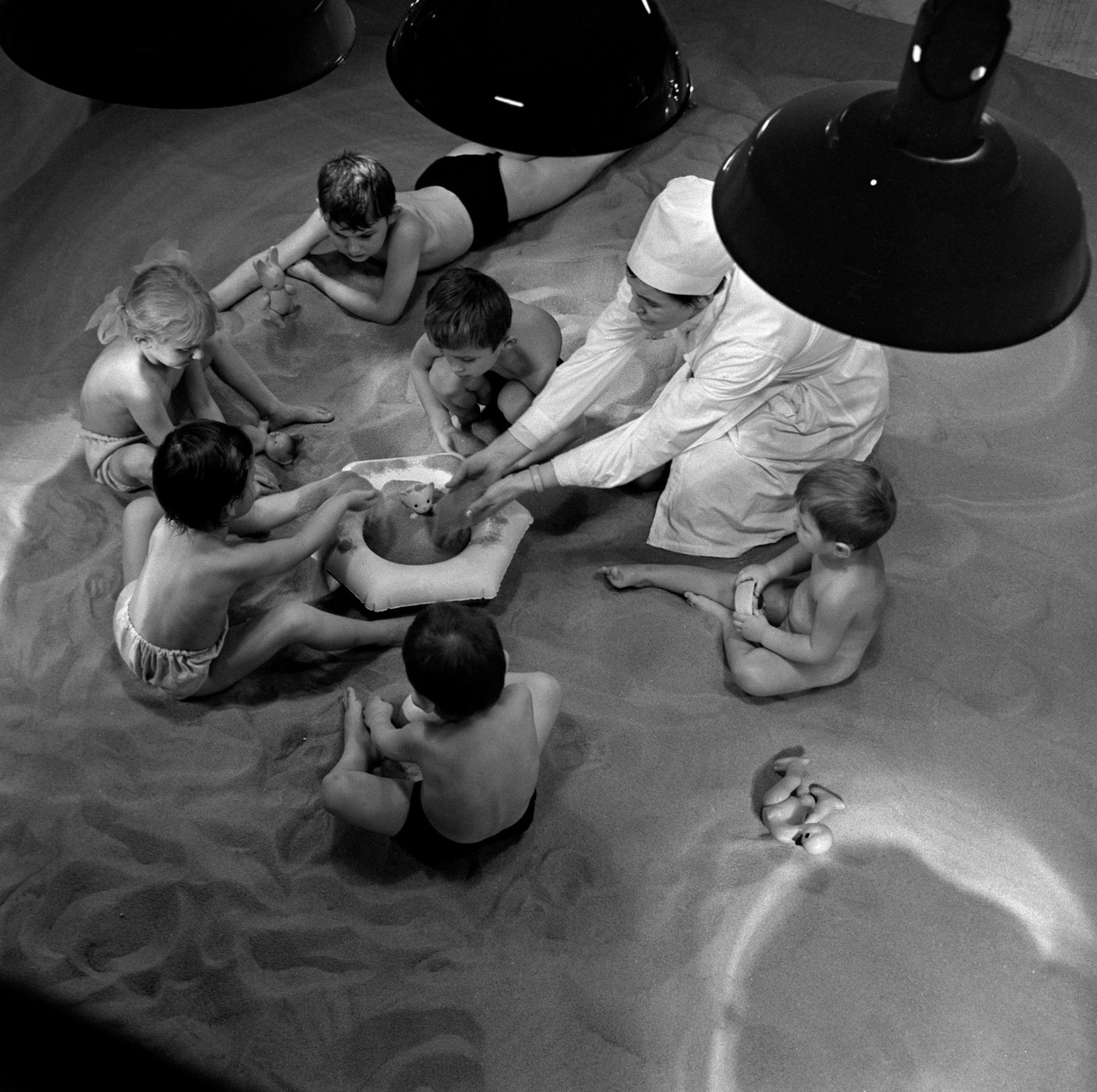 Children playing in an indoors sandbox. Murmansk, a city in Russia lying above the Arctic Circle (1971)