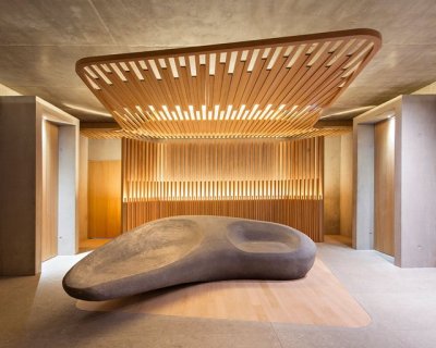 archatlas:<br /><br /><br />Hôtel des Berges’ Spa des Saules in Illhaeusern<br /><br /><br />Conceived as a contemporary reinterpretation of an Alsatian farm by the agency <br /><br />Jouin Manku, the Hôtel des Berges’ Spa des Saules <br /><br /> of 800m² reflects in its design the timber frames of the region’s large old barns, built with untreated materials the structure is built out of solid timber structure with a dark gray tiled roof, set in a concrete volume and further solidified into the ground through a smooth stone base.<br /><br /><br />Follow the Source Link for image sources and more information. <br /><br /><br />