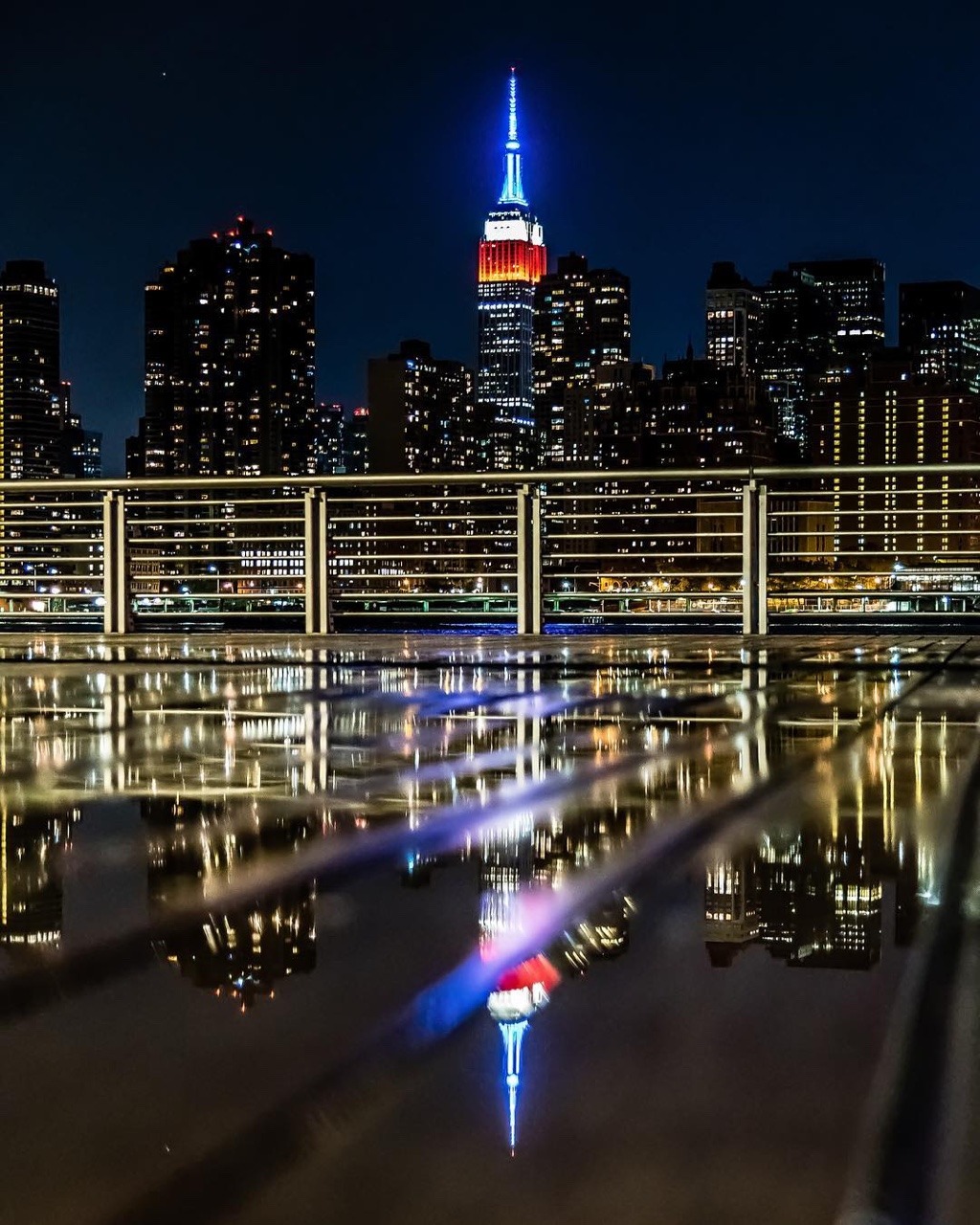 Empire State Building shines red, white and blue by Javan Ng Photography