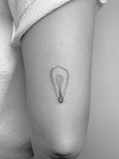 By Daniel Winter, done in Los Angeles. http://ttoo.co/p/103145 small;lighting;single needle;danielwinter;micro;line art;tricep;tiny;ifttt;little;light bulb;other;fine line