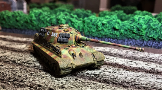 7 Tiger II moving in field, frontal view