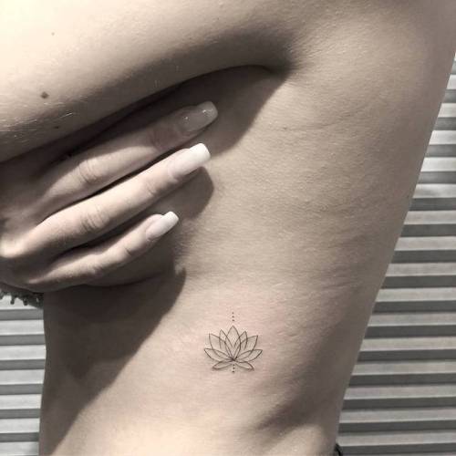 By Chang, done at West 4 Tattoo, Manhattan.... flower;small;chang;line art;rib;tiny;ifttt;little;nature;minimalist;hindu;religious;fine line;lotus flower