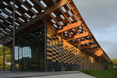 archatlas:<br /><br /><br /><br />Besançon Art Center and Cité de la Musique Kengo Kuma  Associates<br /><br />From the architect:Located in the eastern part of France, Besancon is also known as the city where Seiji Ozawa won the first prize at the International Competition of Orchestra Conductors (1959). Situated in the center of the city along the banks of the Doubs River, this multipurpose cultural facility is part of the FRAC project in France to stimulate cultural activity in regional areas, and features a music hall, contemporary art museum and conservatory (music school).The brick-clad warehouse that was built in the 1930s was converted into a museum. This structure, as well as the newly built music hall and conservatory are covered with a large green roof to tie them all together. Voids are provided between the respective boxes, and this space is covered by a green roof with a mosaic of plants and solar panels that allows soft light to come through.Images and text via <br /><br /> Kengo Kuma  Associates<br /><br />