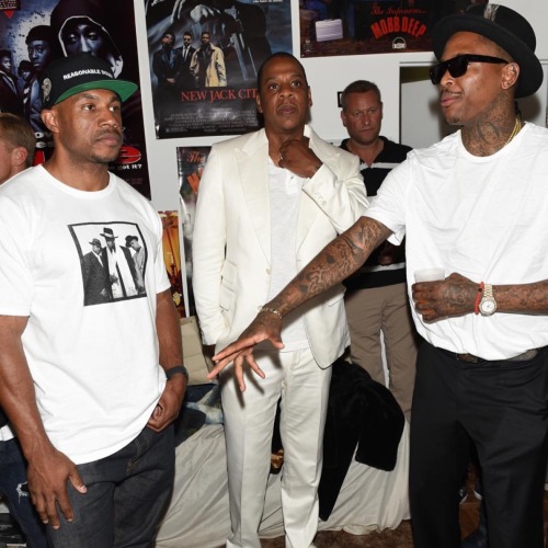 YG and Jay Z take a picture with each other and Camel looking awkward ...