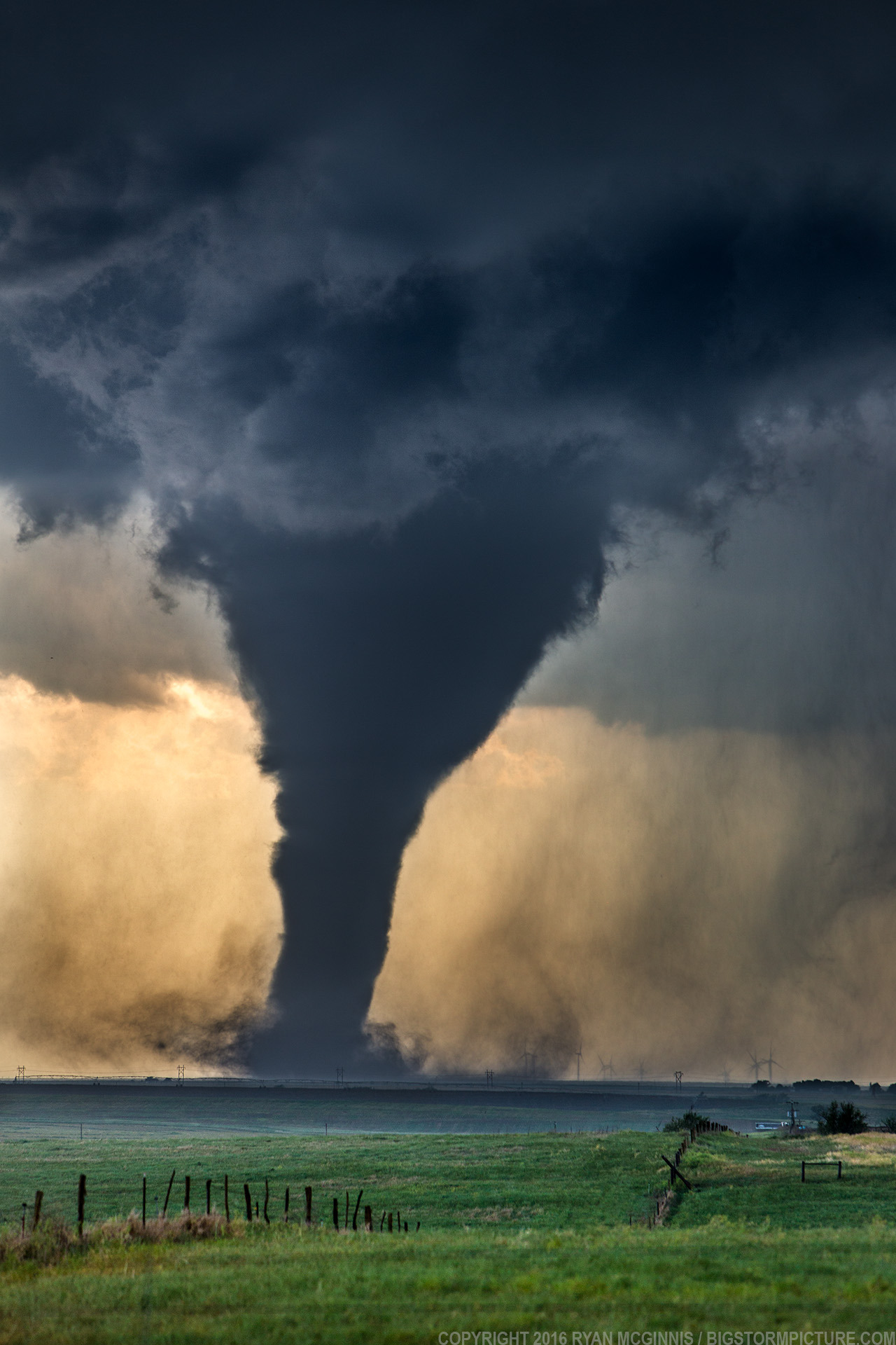 Atmospheric Phenomena — Tornado! A tornado churns near wind generators...