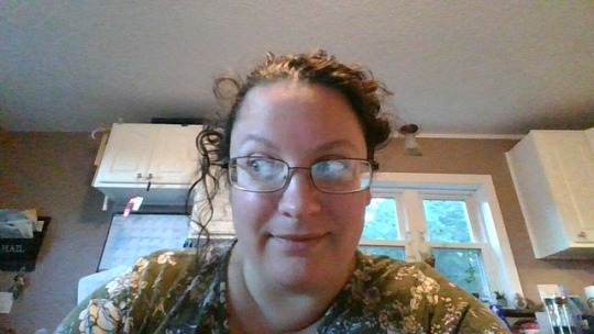 Me, looking dubiously at one of my own curls