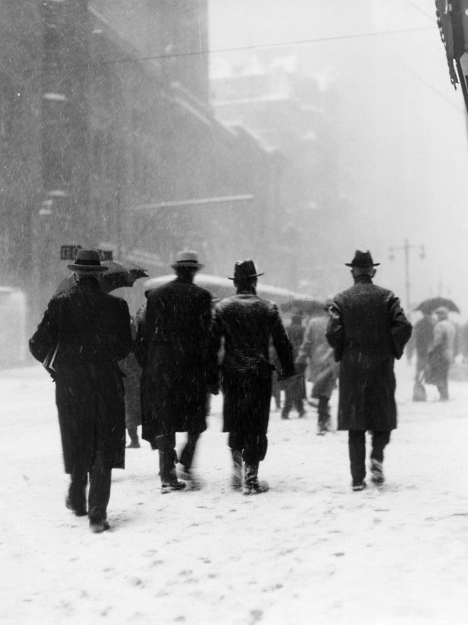 MEZZALUNA.ME - pedestrians in winter snow on city street in bad...