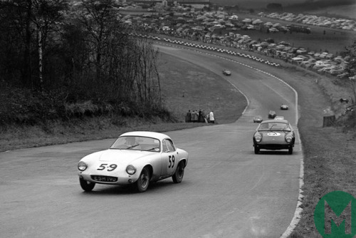 Jim Clark leading Colin Chapman, both Lotus Elite:s, during the...