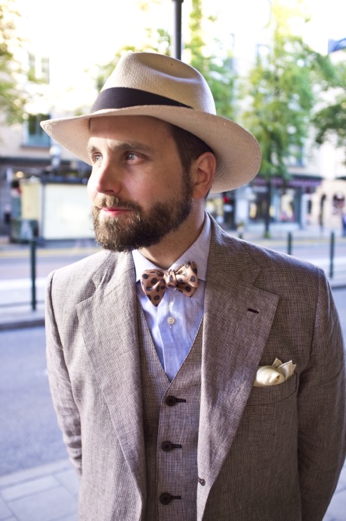 Wearing a hat, 3-piece AND bow tie may take an... - So What Else Is New?