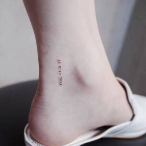 By Witty Button, done in Seoul. http://ttoo.co/p/35984 small;micro;wittybutton;tiny;french tattoo quotes;ankle;ifttt;little;typewriter font;minimalist;font;je m en fous;quotes