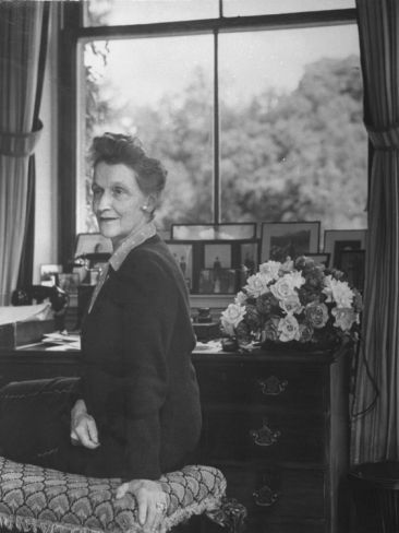 Somerset Levels — Lady Nancy Astor, seated at her desk at Cliveden...