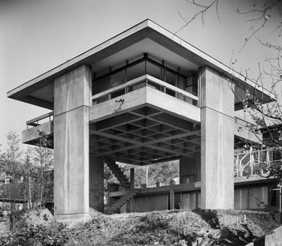 ryanpanos:<br /><br />The Metabolist Sky House | Kiyonori Kikutake | Socks Studio<br />The house the Japanese architect Kiyonori Kikutake (1928-2011) designed and built for himself in 1958, still stands out as a monument to his life-long architectural beliefs. A founding member of theMetabolist movement, Kikutake laid the foundation for an architecture able to intrinsically provide its own rules for growth, and for new models of cities able to develop over new physical grounds. His own Sky-House is an elevated single volume that literally embodies both these key principles on a domestic scale.<br />The house consists of a single 10x10m concrete slab  raised up on 4,5 m high piers located on the central axe of each side, in order to free the corners. The piers also support the concrete roof. The architect’s refusal of functionalism is materialized in an open, flexible floor plan with a central living space and service areas on the sides, which recalls traditional Japanese interiors. All around this single space runs a continuous balcony.<br />