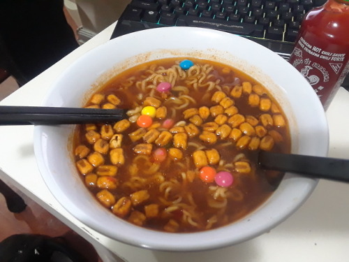 theshittyfoodblog:Spicy ramen with corn nuts and skittles. The...