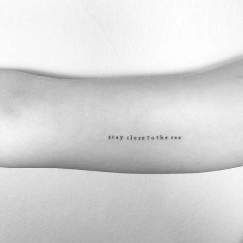 By Cagri Durmaz, done in Istanbul. http://ttoo.co/p/65526 small;inner arm;languages;stay close to the sea;typewriter;tiny;cagridurmaz;ifttt;little;english;minimalist;quotes;other;english tattoo quotes