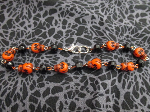 (via Black and Orange Halloween Skull Beaded Bracelet from...