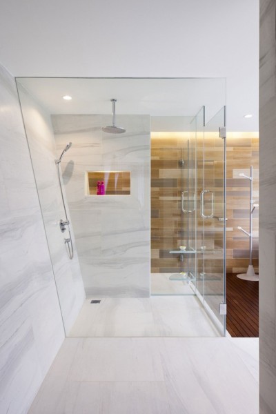 Bathroom features a large walk-in shower which uses a mix of marble, tile and wood in this home located in Ho Chi Minh City, Vietnam. [1133 × 1700]