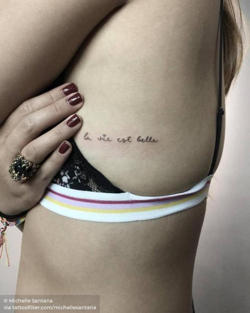 By Michelle Santana, done at Sacred Tattoo, Manhattan.... side boob;small;la vie est belle;french tattoo quotes;facebook;twitter;michellesantana;lettering;quotes