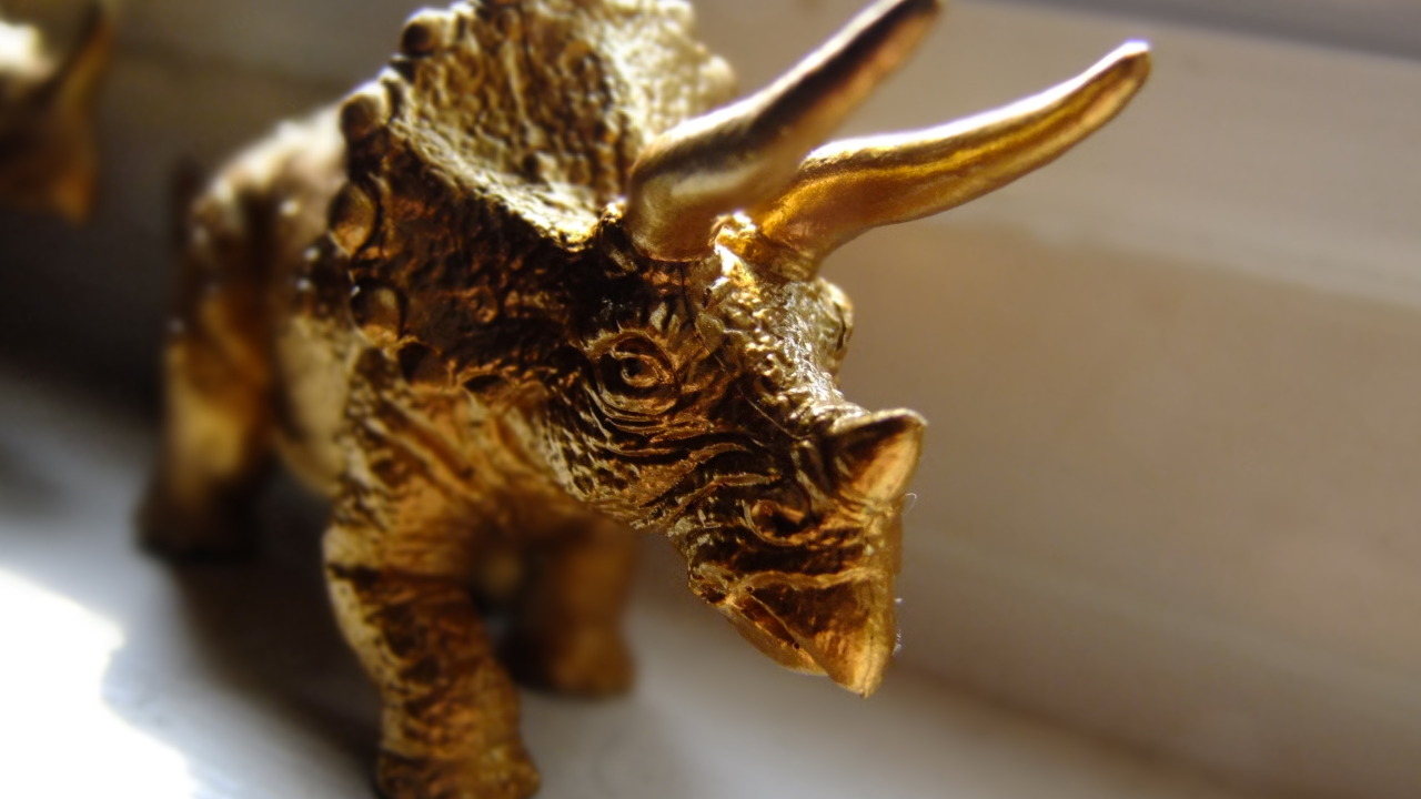 brass dinosaur figurine