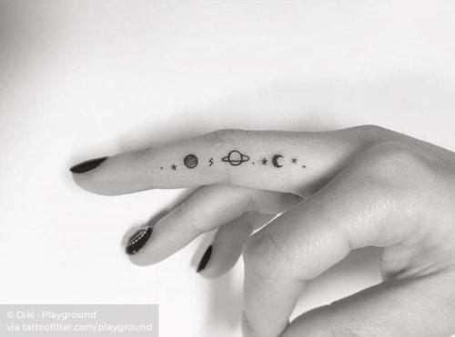 Little moon tattoo placed on the finger minimalistic