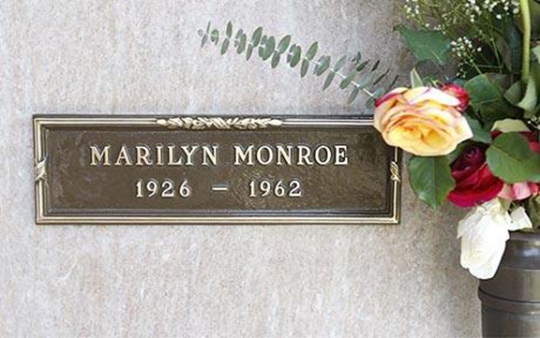 Marilyn monroe crypt slot was hanging on the door. 