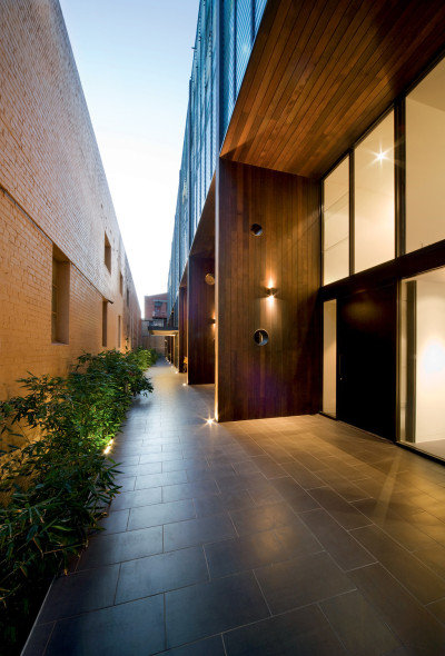 archatlas:<br /><br /><br /><br />Hue ApartmentsHue designed by <br /><br />Jackson Clements Burrows Architects<br /><br />is a 5 level 29 apartment residential development in inner city Richmond, Australia. The project is unusual and innovative providing both a two storey walk-in townhouse type at ground level and three stories of one and two bedroom apartments above. The sectional concept for the building limits the circulation areas to a minimum significantly improving the sellable floor area available to apartments. The facade provides an abstract presence at street level which diminishes the sense of scale of the building relative to the domestic scale of the houses on the opposite side of the street.Images and text via