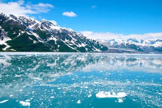 Water and mountain covered with snow in Alaska