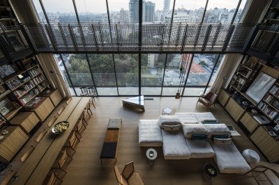 Two-story living room features a catwalk around the room and stunning views of downtown Beirut. [2000 × 1330]