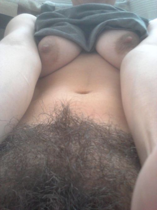 Flashing her hairy pussy