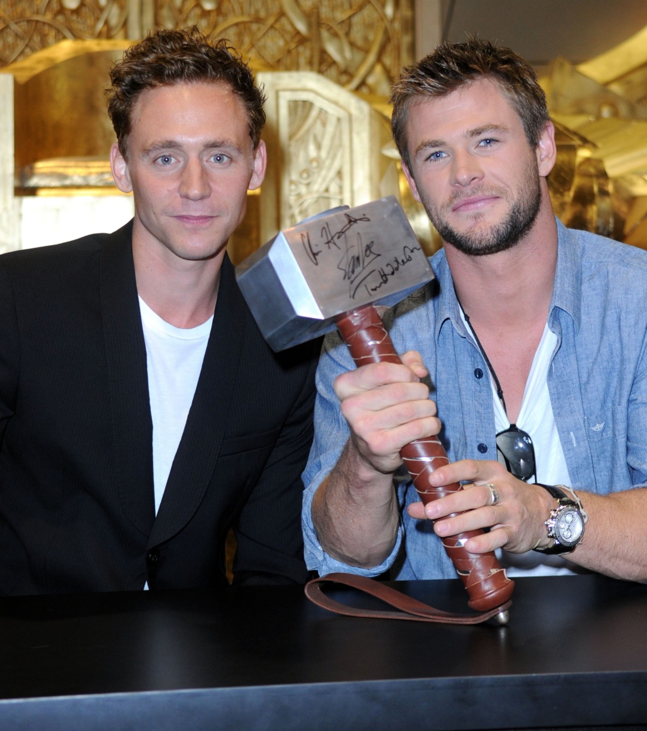 Tom Hiddleston and Chris Hemsworth signing... Hiddles