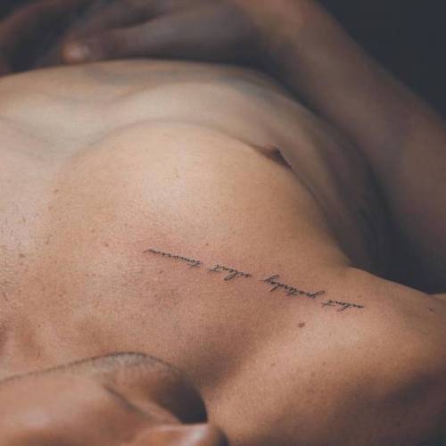 Minimalist wave tattoo on the chest