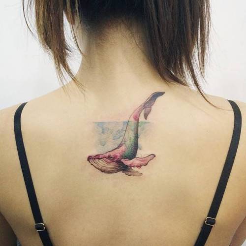 Watercolor style whale on the upper back. Tattoo artist: Doy black;big;whale;watercolor;blue;pink;upper back;tatuaje;tatuajes;orange;green