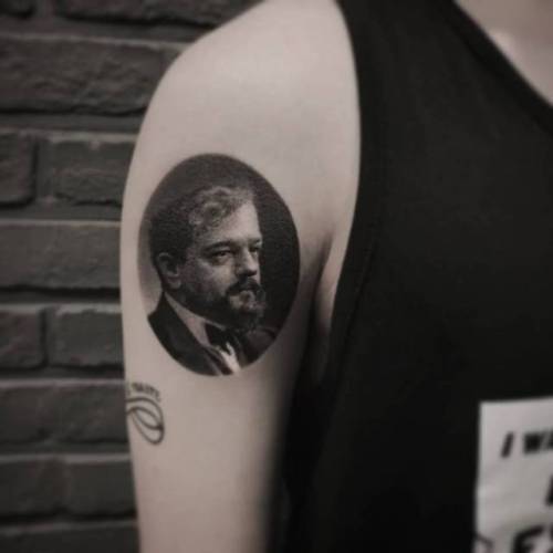 By JeongHwi · Coldgray, done at Cold Gray Tattoo, Seoul.... music;black and grey;small;patriotic;france;jeonghwi;character;facebook;claude debussy;twitter;portrait;upper arm