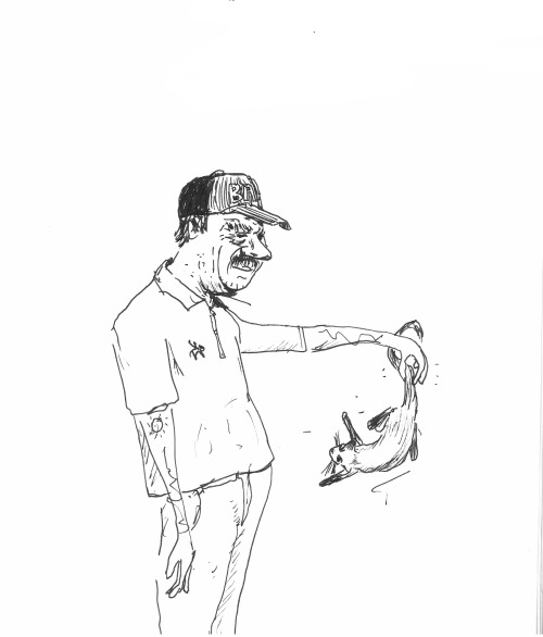 <p>He is holding a cat</p>
<p>©James Kenyon 2013</p>