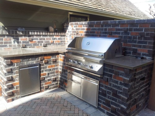 <p>A recent outdoor kitchen installation with antique brick finish and concrete counter top.</p>