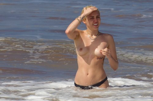 toplessbeachcelebs:Miley Cyrus (Singer) swimming topless in...