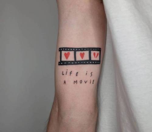 By Victor Zabuga, done in Berlin. http://ttoo.co/p/34503 small;life;languages;tricep;contemporary;tiny;victorzabuga;love;ifttt;little;english;medium size;quotes;other;english tattoo quotes;life is a movie