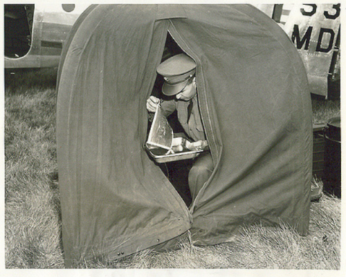 historium:A Sergeant from the photo section of an Army Air...