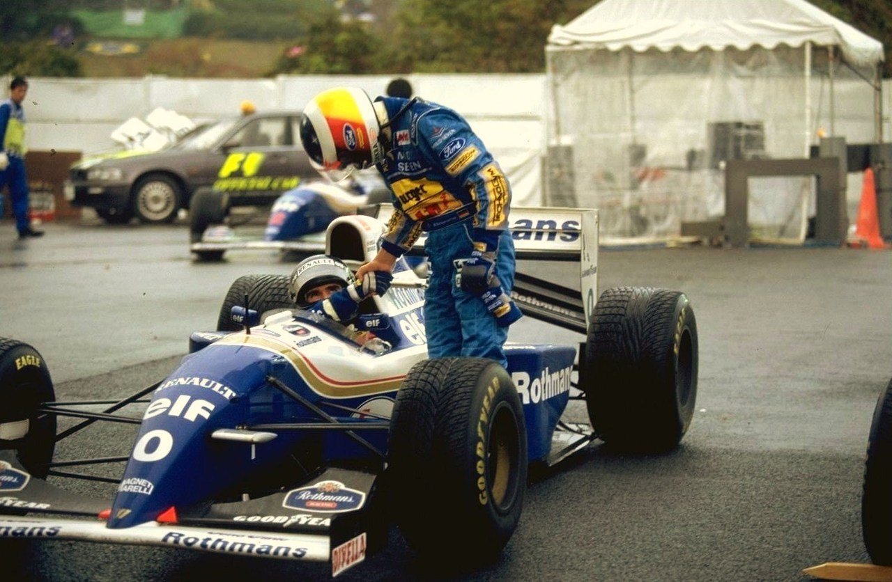 Michael Schumacher shaking hands with Damon Hill after the Japanese Grand Prix in 1994.