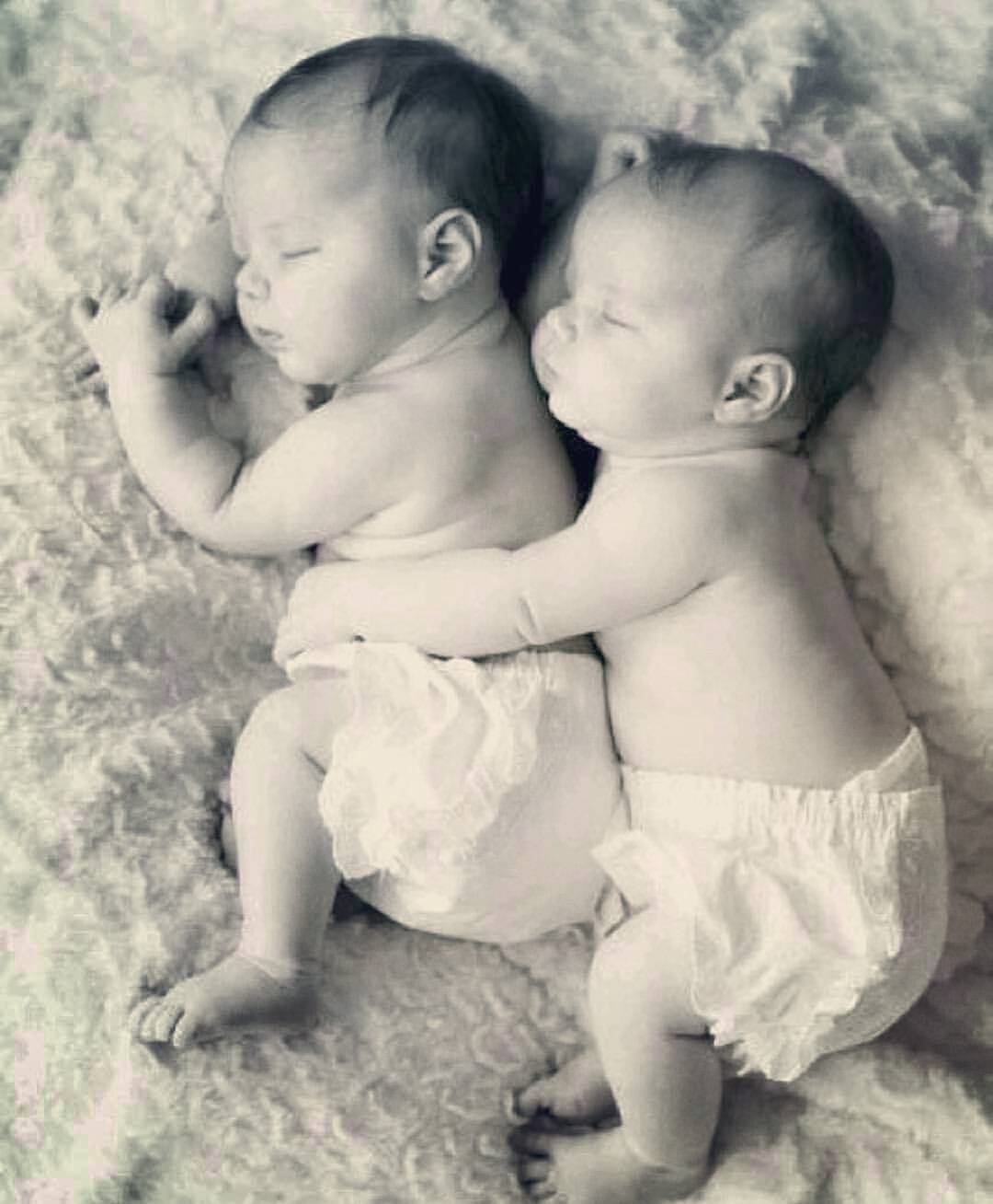 Little sister plays with brother while sleeping