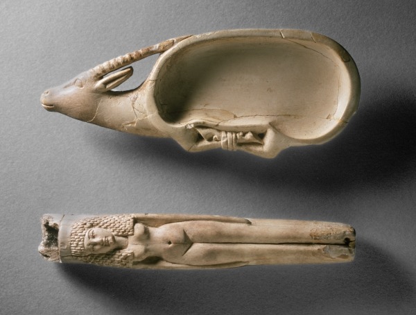 Kohl Tube and Cosmetic Dish  Kohl tube in the form of a nude female and cosmetic dish in the form of an ibex with bound legs (ivory). New Kingdom, 19th Dynasty, ca. 1292-1189 BC. Tomb 562, Qaw el-Kebir (Tjebu). Now in the Ashmolean Museum, Oxford.