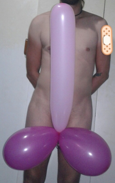 Having fun with some balloons tied to my cage…