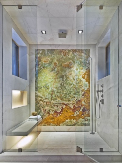 Marble shower with a floating bench and large onyx wall in Lake Creek, Colorado. Photo by Teri Fotheringham. [1920x2560]