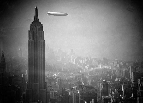 historicaltimes:a German Zeppelin floats past the Empire State...