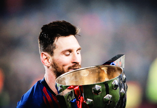 Lionel Messi of Barcelona lifts the La Liga trophy...: Team Messi