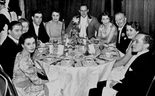 Vivien Leigh   and Leigh Holman dine with fellow attendees...