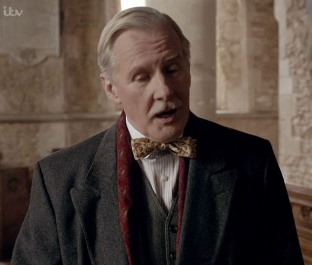 David Robb as Dr. Richard Clarkson in Downton...