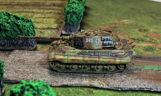 8 Tiger II moving down road, left side view