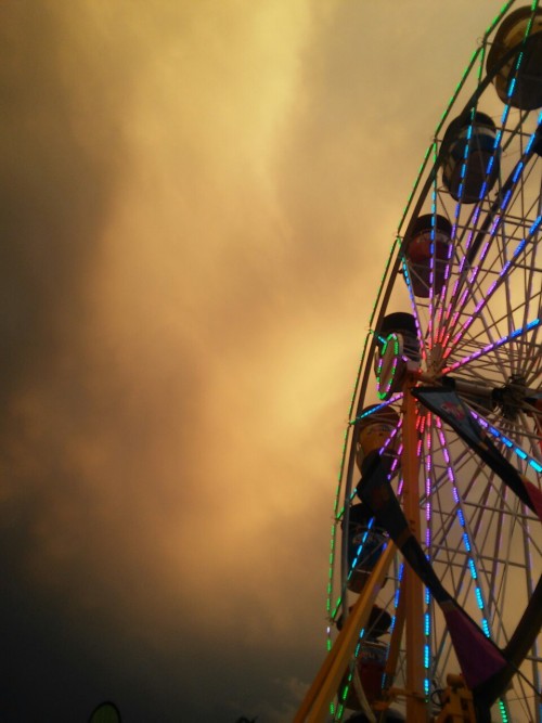 sunshowergal:spooky skies at the fairground tonight