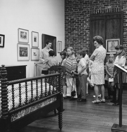 Schoolchildren visiting the Chicago Historical Society look at...